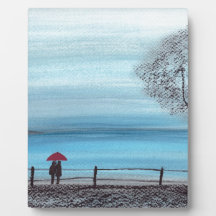 Casal apaixonado por um guarda-chuva vermelho