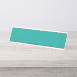 Placa De Mesa Um fundo gradiente misturando azul em verde.
