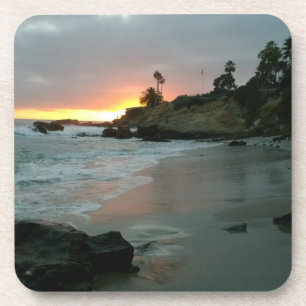 Porta-copo Belo pôr do sol sobre os saltos da praia