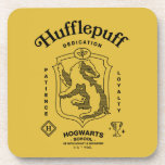 Porta-copo HUFFLEPUFF™ Dedication Patience Loyalty Crest<br><div class="desc">Celebrate loyalty, patience, and unwavering dedication with this bold Hufflepuff™ crest design. Featuring the proud badger set within a classic shield, this striking artwork highlights the house’s defining traits — Dedication, Patience, and Loyalty — in a timeless, vintage-inspired layout. Rendered in signature house colors with detailed linework and subtle magical...</div>