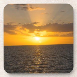 Porta-copo Pôr do sol brilhante no oceano