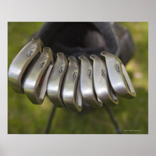 Póster Cabeças de clube do golfe em um saco. Três a nov