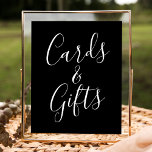 Poster Símbolo de presentes e cartões de casamento negros<br><div class="desc">Este simples e elegante cartaz de casamento mostra a frase "Cartões e Presentes" em escrito branco sobre um fundo preto impressionante, oferecendo um toque sofisticado para o seu evento. Personalize o sinal com texto personalizado opcional, como seus nomes, data de casamento ou uma mensagem obrigado-você sincera, para torná-lo realmente único....</div>