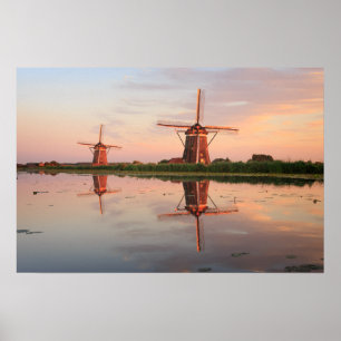 Poster Two windmills with reflection at sunset