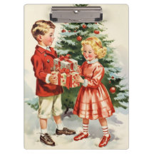 Boy and girl giving each other Christmas presents