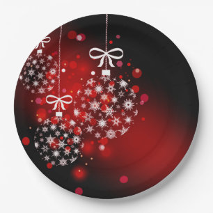 Prato De Papel Flocos de neve sobre fundo vermelho e preto.