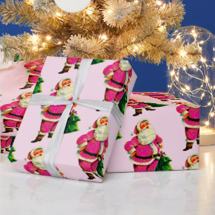Presente Papais noeis cor-de-rosa no papel de enrolamento d