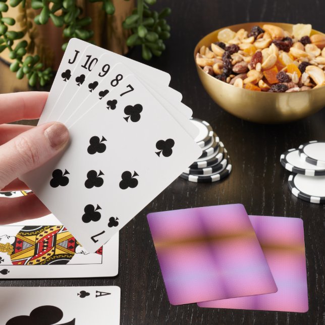 Quatro cartas de baralho estão dispostas em leque (In situ)