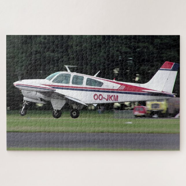 Quebra-cabeça Beechcraft Bonanza OO-JKM - Aeroporto de Kemble (Horizontal)