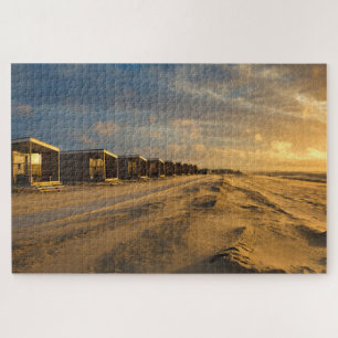 Quebra-cabeça Cabinas de praia no pôr do sol na costa holandesa