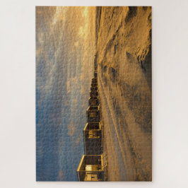 Quebra-cabeça Cabinas de praia no pôr do sol na costa neerlandes