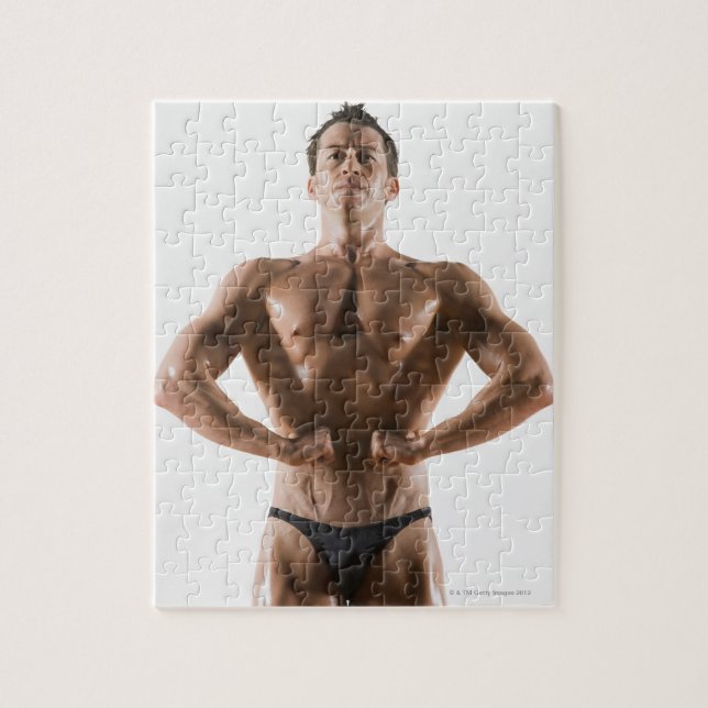 Quebra-cabeça Criador de corpo masculino flexionando e posando (Vertical)