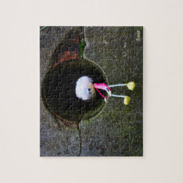 Quebra-cabeça Fubby poppetje dat in een muur zit. Een schattig m