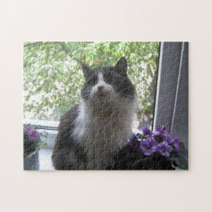Quebra-cabeça Gato preto e branco e flores.