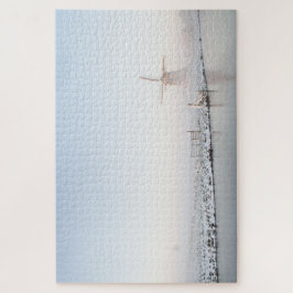 Quebra-cabeça Moinho de vento em uma paisagem branca da neve no