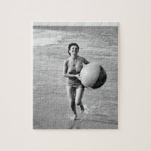 Quebra-cabeça Mulher com uma bola de praia