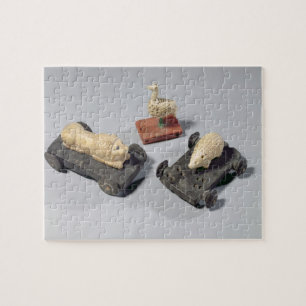 Quebra-cabeça Os brinquedos das crianças: um ouriço, um leão e