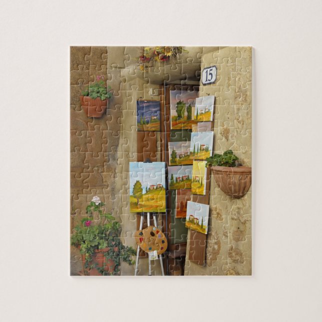Quebra-cabeça Pequena loja com obras de arte à venda na calçada (Vertical)