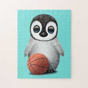 Quebra-cabeça Pinguim bonito do bebê que joga com basquetebol
