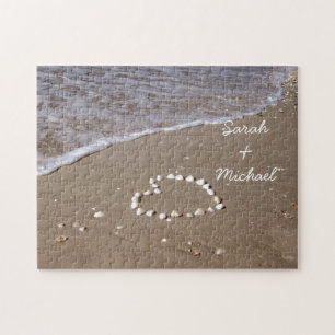 Quebra-cabeça Shell Heart na praia Sandy
