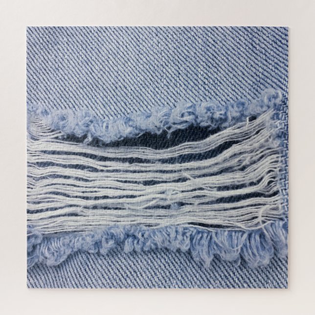Quebra-cabeça Textura de Jeans rasgados azuis claros (Vertical)