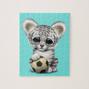 Quebra-cabeça Tigre Cub branco com a bola de futebol do futebol