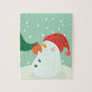 Quebra-cabeça Um boneco de neve que pendura um ornamento em uma