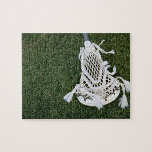 Quebra-cabeça Vara do Lacrosse na grama