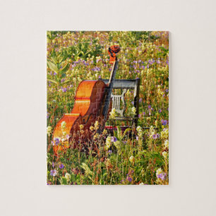 Quebra-cabeça Violoncelo com cadeira em um campo dos wildflowers