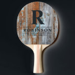Raquete De Ping Pong Worn Blue Wash Wood Family Name & Initial<br><div class="desc">Worn Blue Wash Wood Family Name & Initial Ping Pong Paddle brings a relaxed coastal charm to every rally, capturing the easygoing spirit of gatherings where laughter flows as freely as conversation. The weathered blue aesthetic evokes the feeling of seaside cottages, sunlit afternoons, and friendly matches shared among family and...</div>