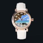 Relógio Costa Tropical de Praia com Grande Rock<br><div class="desc">Um relógio com uma fotografia cênica da natureza. Belo mar azul de turquesa com uma praia arenosa. Uma rocha marrom grande fornece sombra do céu azul brilhante.</div>