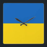 Relógio de Parede com Bandeira da Ucrânia<br><div class="desc">Adicione um toque distinto à sua casa ou escritório, com o nosso relógio de parede exclusivo com a bandeira da Ucrânia! Feito com muita atenção aos detalhes, este relógio de parede é mais do que apenas um item funcional; é uma expressão vibrante do orgulho e da herança ucranianos. O design...</div>