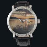 Relógio De Pulso Sunset no Lago Wrist Watch<br><div class="desc">Este relógio de pulso, com seu único rosto de foto cênico e correia preta de couro é um presente de excelente para um aposentado, aniversário, Dia de os pais, Natal ou outra ocasião. O rosto de relógio é uma paisagem original tirada ao pôr do sol em Caples Lake na Califórnia....</div>