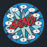 Relógio Grande CQ Book Pop Art BANG<br><div class="desc">Tendência divertida, pop de quadrinhos super-heróis que certamente adicionarão um splash de cor a uma variedade de salas em sua casa ou escritório. Uma maneira ideal de se tratar a si mesmo ou a alguém que você conhece com estes relógios de desenhista legal e únicos. Por que não adicionar um...</div>