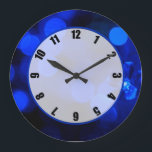 Relógio Grande Luzes azuis de férias<br><div class="desc">relógio de 10, 75" em acrílico redondo com uma imagem de luzes de férias azuis safiras. Face do relógio fácil de ler num círculo transparente branco com borda azul. Veja toda a coleção de Relógios de Chanucá sob a categoria HOME na seção HOLIDAYS.</div>