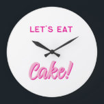 Relógio Grande Wall Clock<br><div class="desc">Add a sprinkle of sweetness to your space with this fun and playful wall clock! Featuring bold, pink typography and the delicious phrase “LET’S EAT Cake!”, this design is perfect for kitchens, dining rooms, cafés, or anywhere you want to serve up some joy. Whether you're a dessert lover, a baking...</div>