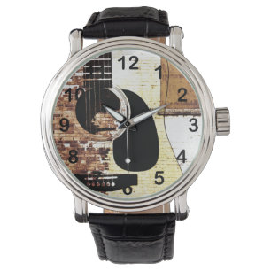 Relógio guitarra acústica sobre fundo de tijolos