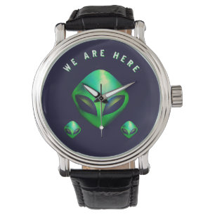 Relógio "Nós Estamos Aqui" cabeça de Alien Verde