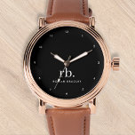 Relógio preto e branco mínimo Elegante clássico monograma<br><div class="desc">Um design de monograma minimalista com grandes iniciais tipográficas em uma fonte clássica com seu nome abaixo em um simples fundo preto. O presente ou acessório perfeitamente personalizado!</div>