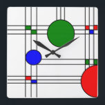 Relógio Quadrado Art Deco<br><div class="desc">Este relógio de parede tem um design de janela de vidro colorido de arte de linhas pretas e quadrados e círculos vermelhos, azuis e verdes.</div>