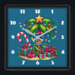 Relógio Quadrado Árvore Tropical de Palma de Natal<br><div class="desc">Um relógio com uma imagem de feriado sazonal. Uma palmeira tropical decorada em luzes festivas com uma estrela no topo. Uma bengala branca e vermelha gigante que sai da areia. Presentes de Natal debaixo da árvore. Whimsical e divertido.</div>