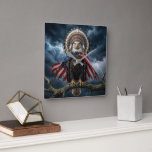 Relógio Quadrado Bald Eagle Wearing an American Flag Cape<br><div class="desc">A bald eagle is perched on a tree branch during a thunderstorm,  wearing an American flag and a Native American feather headdress.</div>