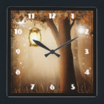 Relógio Quadrado Floresta Mágica com Luzes Fadas<br><div class="desc">Um relógio com uma ilustração quimicamente encantadora em cores ricas marrom e amarelo. Uma floresta mística mágica com uma grande árvore segurando uma lanterna antiquada. Luzes de fada dançando ao redor. Uma design maravilhosa e encantadora.</div>