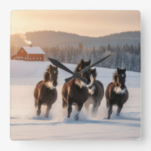 Horses galloping on a winter morning -