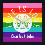 Relógio Quadrado Love Typografia Gay Casal Priorado LGBT Logotipo d<br><div class="desc">Amor é Orgulho gay de Tipografia Casal LGBT Sinalizador LGBT Arco-Íris Stripes Gay Relógio com Nomes Personalizados Charles e John</div>