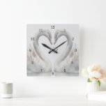 Relógio Quadrado Monograma de Cisnes Românticas<br><div class="desc">Crie uma lembrança especial para sua casa. Este relógio de parede quadrada monograma tem cisnes românticas. Cores neutrais. Personalize os monogramas exibidos no centro. Faz um presente de excelente, presente de casamento, presente de aniversário de casamento e muito mais. Use a modelo para criar seu próprio relógio romântico de monograma....</div>