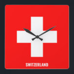 Relógio Quadrado Patriótico suiça Flag Dazzling<br><div class="desc">Suiça Flag Dazzling Patriotic Square Wall Clock nas cores e nos elementos da bandeira nacional Suiça que cobre a frente do relógio. As cores da bandeira nacional são complementadas com o texto "Suiça" na parte inferior. O texto é totalmente personalizável usando o recurso "Personalizar!". Sinta-se livre para alterá-lo, removê-lo ou...</div>