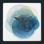 Relógio Quadrado Planetas em Evolução - Círculos de Aquarela<br><div class="desc">Planetas Evolutivos I por Grace Popp. Círculos de aquarela criam formas como planetas que se sobrepõem para revelar belas variações de azul e lacre.</div>