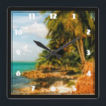 Relógio Quadrado Praia Tropical Dreamy<br><div class="desc">Uma imagem mágica sonhadora. Uma praia tropical brilhante e ensolarada com nuvens brancas e sábia por cima, num ponto isolado, cercada por palmeiras grandes. Uma velha cabana de palha senta na praia parecendo quebrada e devastada pelo tempo. As águas tranquilas são um azul legal e verde-turquesa. Imagem usa fotografia HDR...</div>