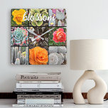 Relógio Quadrado Script de citação do Blossom de Colagem de Fotogra<br><div class="desc">Rosas brilhantemente vermelhos, amarelos e laranja-acinzentados e verde-amarelado, aqua e cactos pretos gritam quente, dias de verão. Aproveite as flores e a atmosfera pacífica de um jardim vibrante sempre que você verificar o tempo neste assombroso relógio da fotografia gráfica. Faz um presente excelente para o lar! Você pode personalizar facilmente...</div>